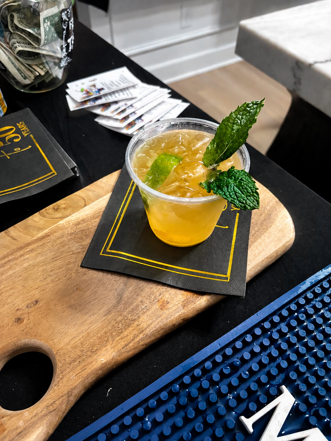 Golden cocktail with lime and fresh mint
