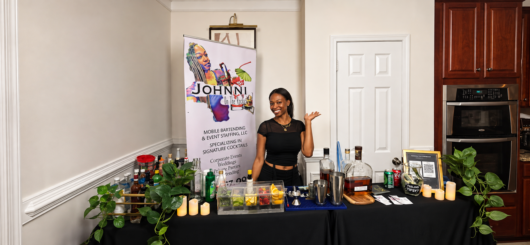 Johnni smiling behind a complete mobile bar setup